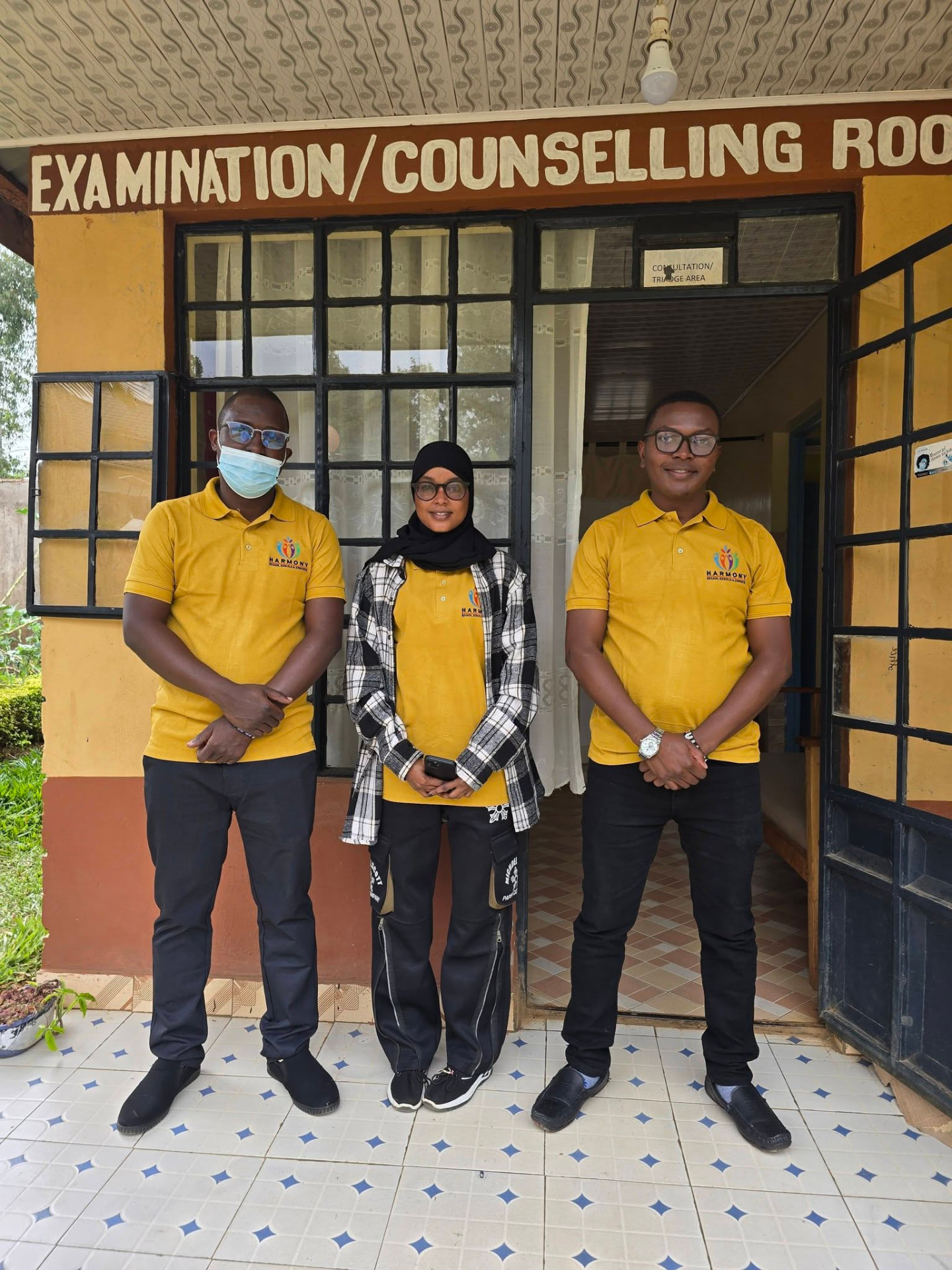 Staff outside the examination and counselling room